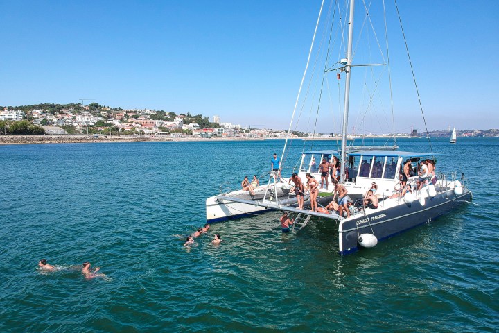 a group of people in a boat on a body of water